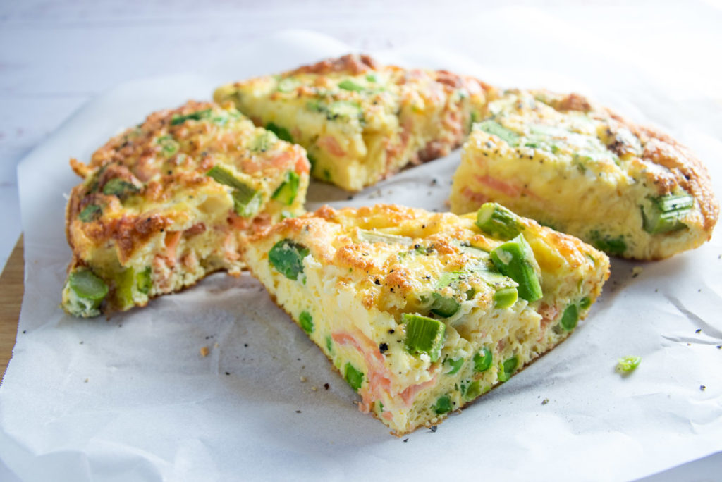 This incredibly quick and easy oven baked Salmon, Asparagus and Pea Frittata recipe makes a delicious and simple weeknight dinner or weekend lunch. 