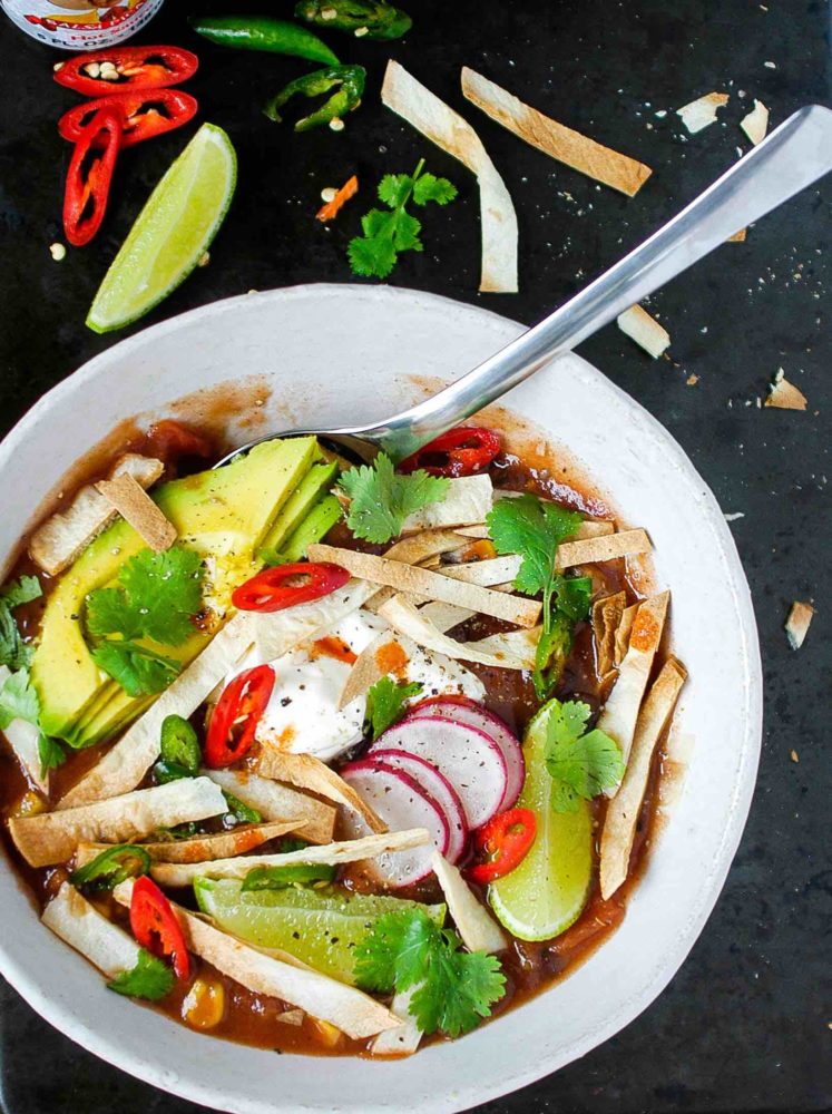 A delicious, heart Mexican soup - don't forget the toppings! 