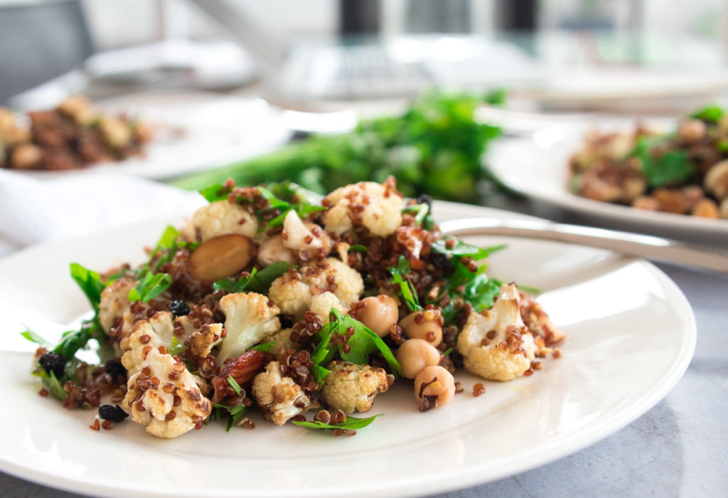 This super healthy and hearty roasted cauliflower, quinoa and almond salad is perfect on its own or as a side for lamb or chicken.